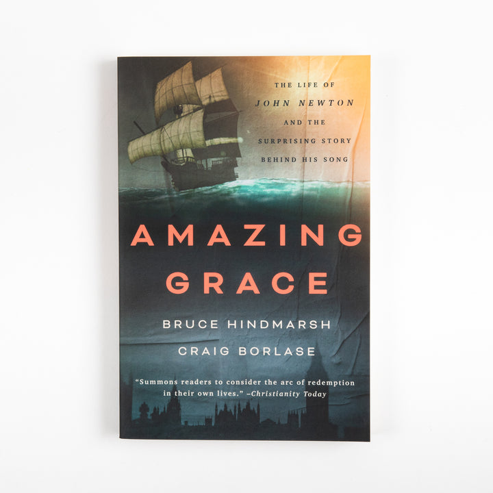 Front cover of Amazing Grace: The Life of John Newton and the Surprising Story Behind His Song, showing a three-masted sailing ship on teal ocean waves beneath an orange sunset, with the title in coral letters and a silhouette of London&