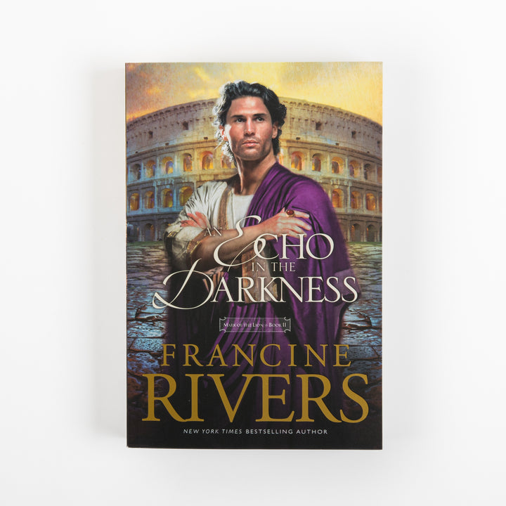 Front cover of An Echo in the Darkness, Mark of the Lion Series Book 2, by Francine Rivers, shown straight-on. A young Roman man with dark curly hair and a short beard stands with arms crossed, wearing a white tunic and purple toga, in front of the Colosseum under a glowing golden-orange sky. The title is in white script, FRANCINE RIVERS appears in large bold gold letters, and New York Times Bestselling Author is printed beneath the author name.