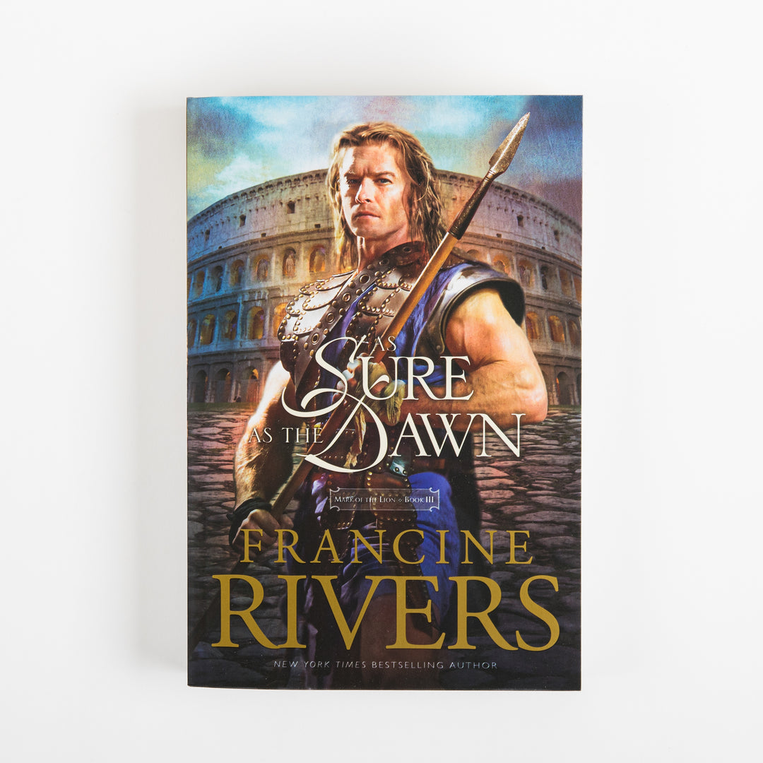 Front cover of As Sure as the Dawn (Mark of the Lion, Book 3) by Francine Rivers. A muscular, bare-armed Roman warrior with long hair grips a spear, standing on stone pavement in front of the ancient Colosseum beneath a blue sky. The title &