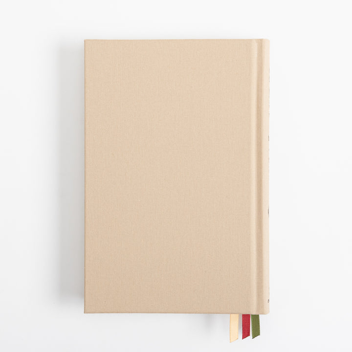 Straight-on view of the plain tan linen back cover, unadorned aside from its woven fabric texture, with three ribbon markers - cream, red, and olive green - visible tucked along the bottom edge near the spine.