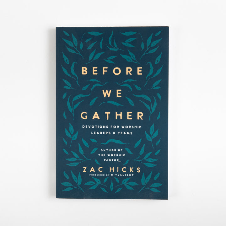 Front cover of Before We Gather: Devotions for Worship Leaders and Teams by Zac Hicks, a dark teal book cover with a gold and teal leaf-vine pattern surrounding cream title text, subtitle &