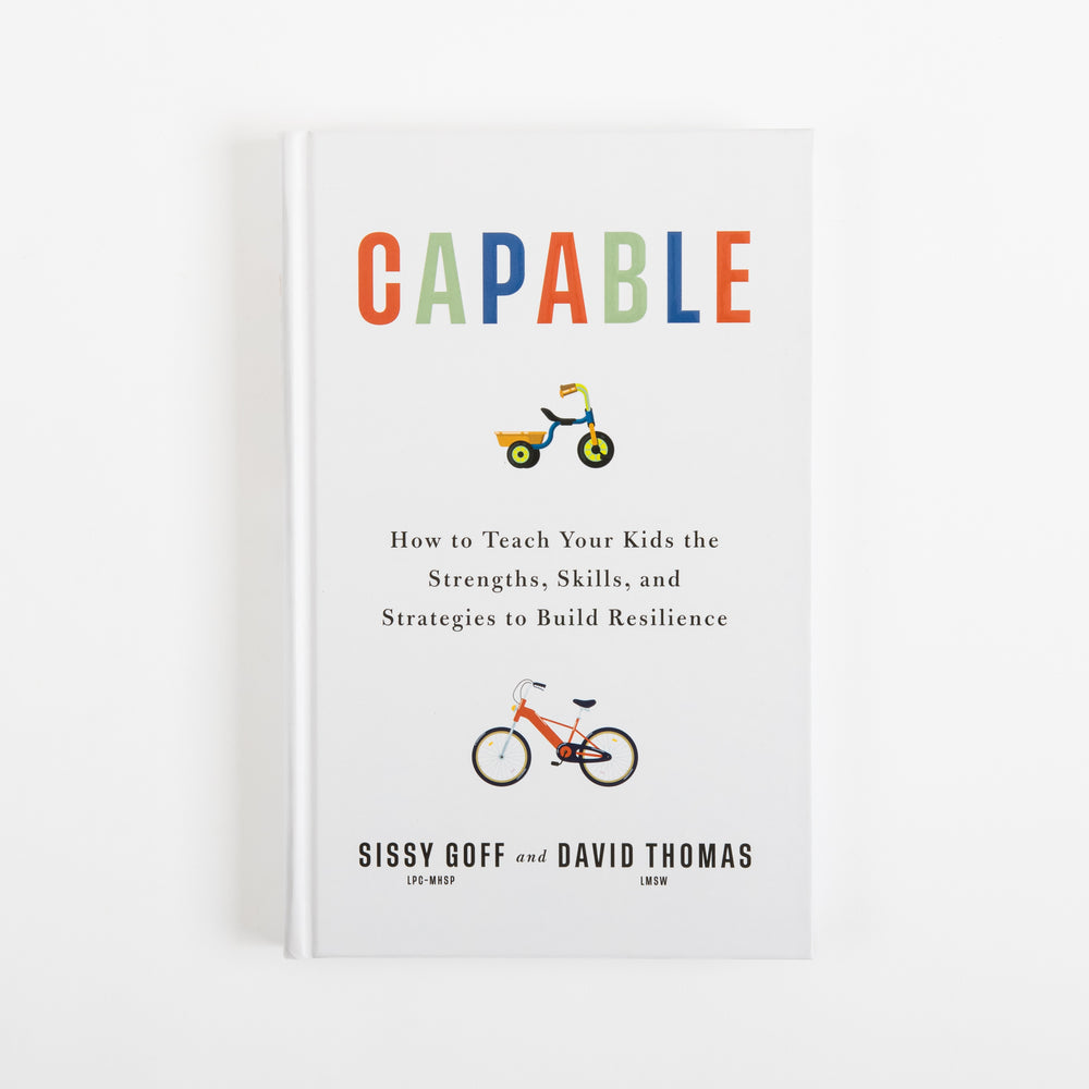 Front cover of Capable by Sissy Goff and David Thomas: a white hardcover with the title in red, green, and blue letters, a small tricycle icon below the title, an orange bicycle icon lower on the cover, and the subtitle How to Teach Your Kids the Strengths, Skills, and Strategies to Build Resilience above the authors' names.