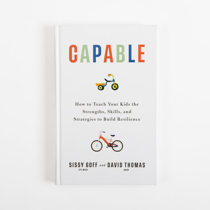 Front cover of Capable by Sissy Goff and David Thomas: a white hardcover with the title in red, green, and blue letters, a small tricycle icon below the title, an orange bicycle icon lower on the cover, and the subtitle How to Teach Your Kids the Strengths, Skills, and Strategies to Build Resilience above the authors&