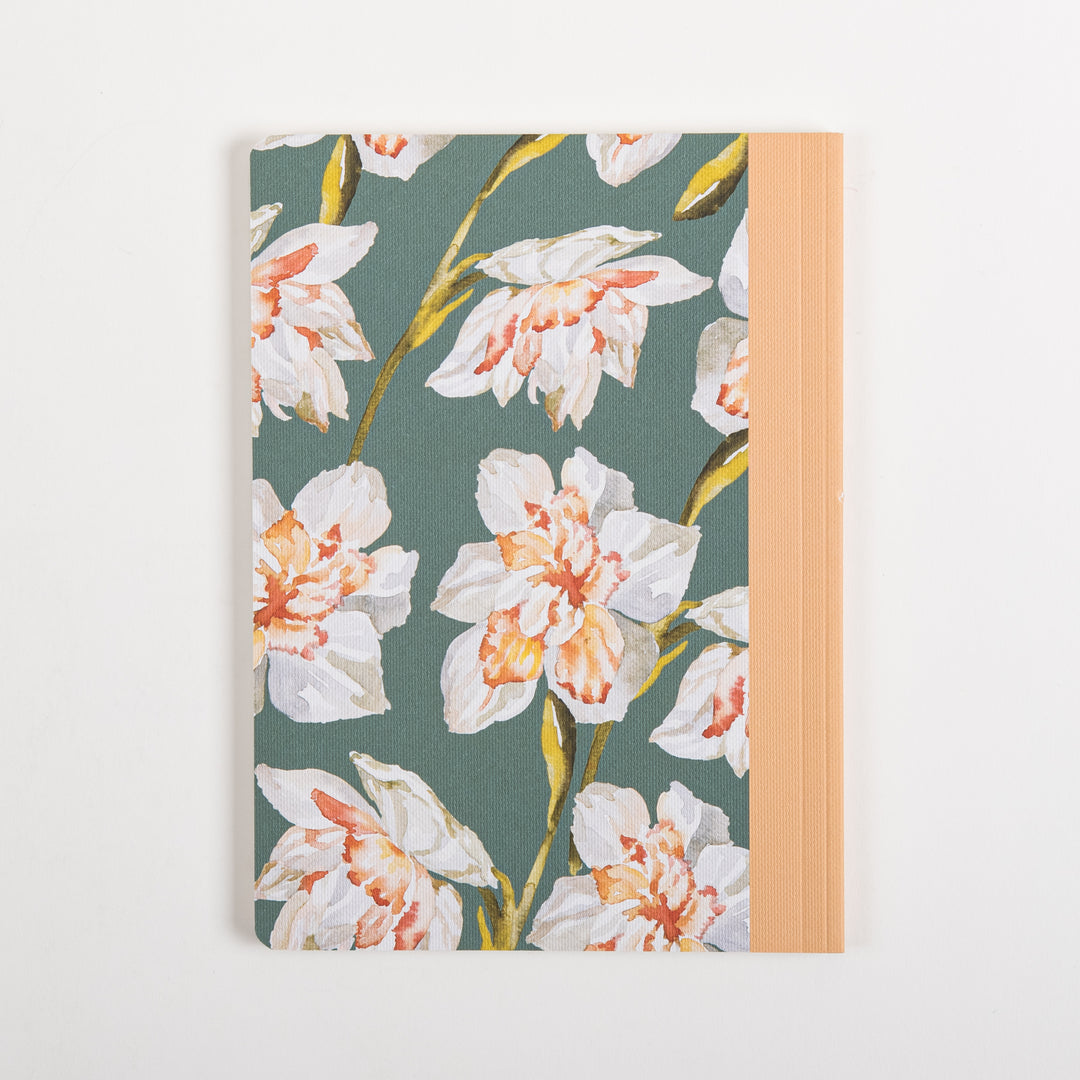 Back cover of the ESV Prayer Journal: 30 Days on Evangelism, lying flat, showing the full sage green fabric cover with a watercolor pattern of white and peach daffodils on flowering stems, and the peach cloth spine visible along the right edge.