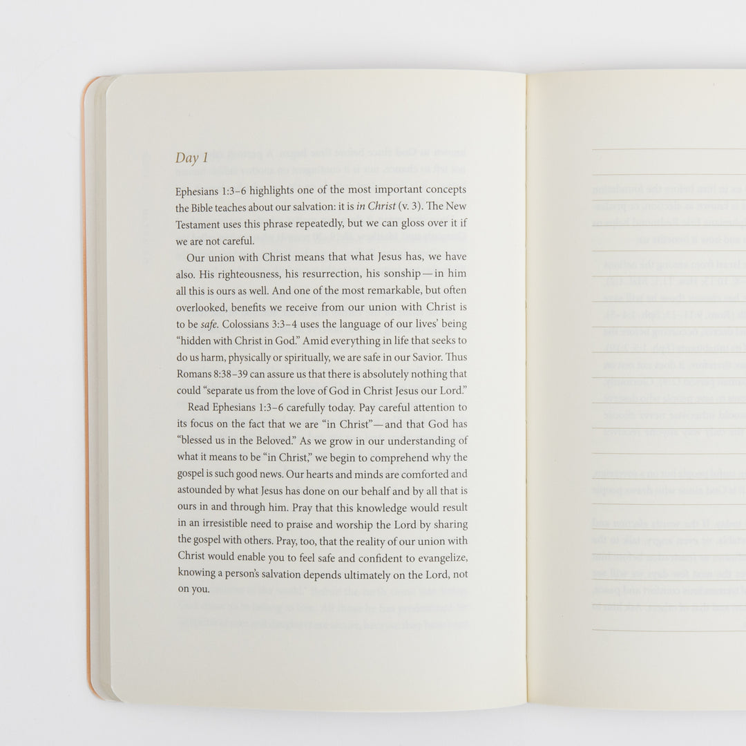 Open interior spread showing a "Day 1" devotional reading on the left page about union with Christ based on Ephesians 1:3-6, Colossians 3:3-4, and Romans 8:38-39. The right page is a blank ruled page with horizontal lines for personal journaling and prayer notes.