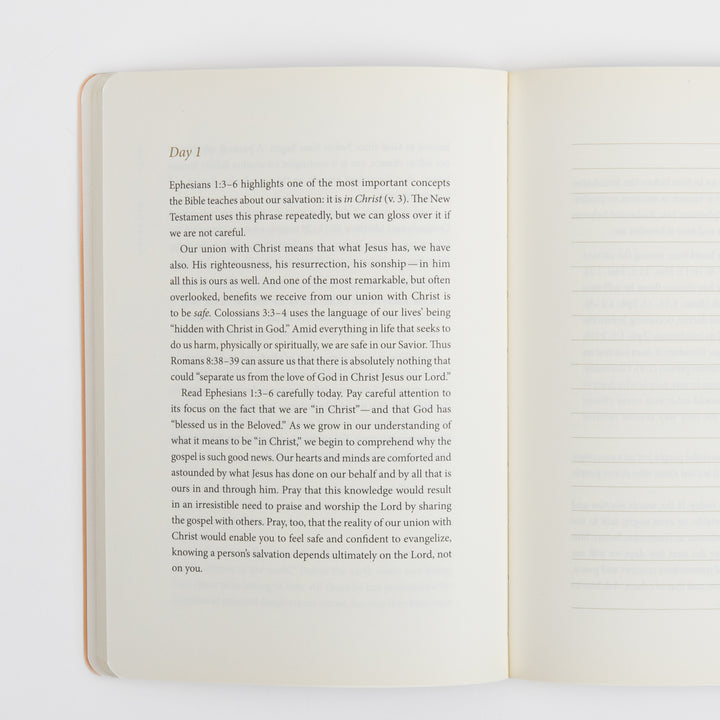 Open interior spread showing a "Day 1" devotional reading on the left page about union with Christ based on Ephesians 1:3-6, Colossians 3:3-4, and Romans 8:38-39. The right page is a blank ruled page with horizontal lines for personal journaling and prayer notes.