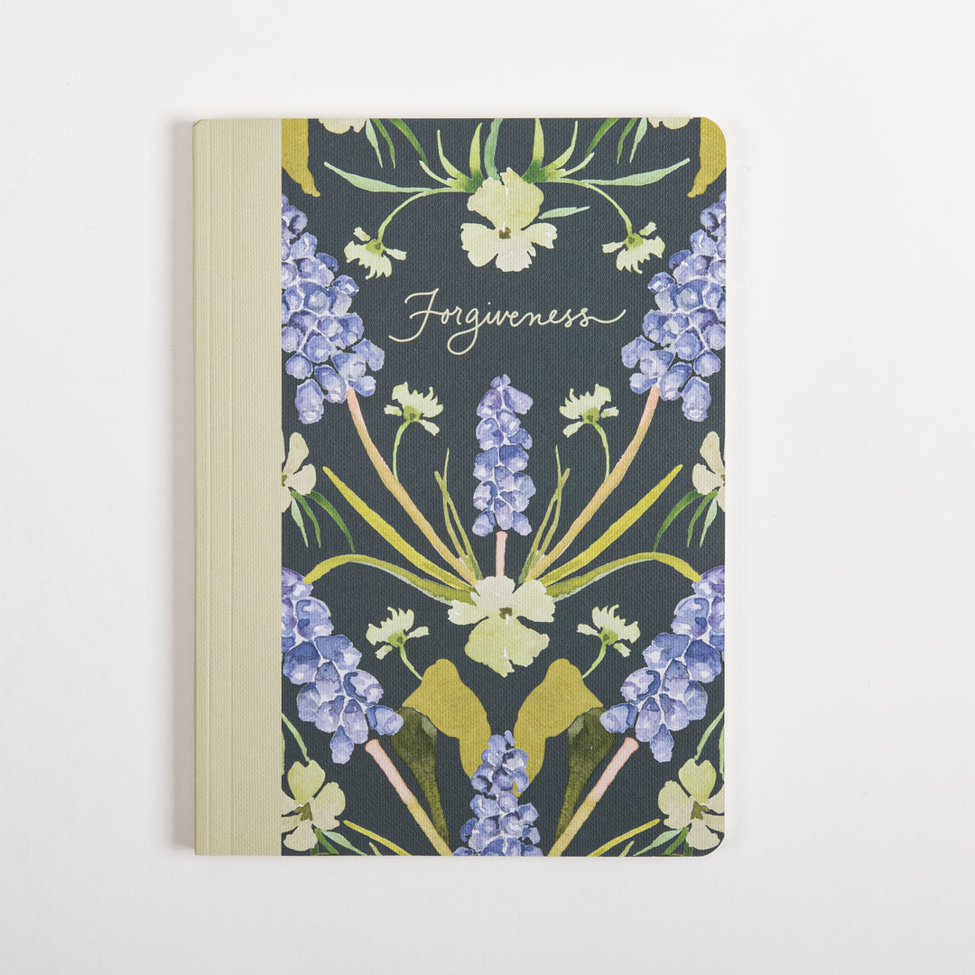 Straight-on front cover of the ESV Prayer Journal: 30 Days on Forgiveness, showing a cream fabric spine beside a dark green cover with a symmetrical, mirror-image watercolor pattern of purple grape hyacinth spikes and pale yellow wildflowers, with &