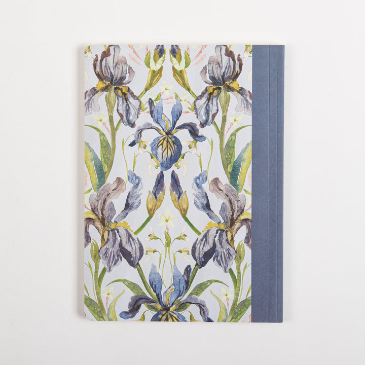 Back cover of the ESV Prayer Journal: 30 Days on Hope, laid flat, showing the same symmetrical mirrored watercolor iris floral pattern in purple, lavender, and blue with gold accents on a cream background, without any text. The blue linen spine is visible along the right edge.