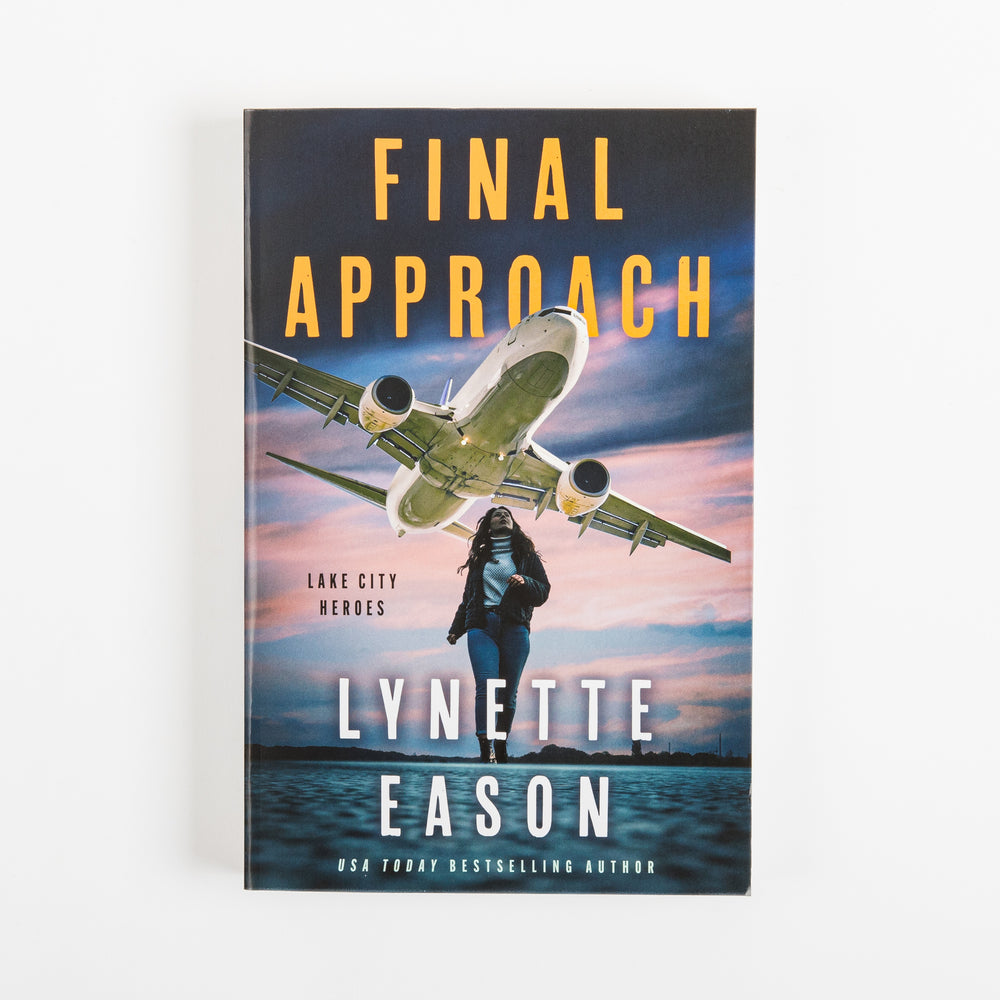 Front cover of 'Final Approach' by Lynette Eason: a green-tinted jet flying just above a woman with long hair walking along a waterfront at dusk, orange 'Final Approach' title, 'Lake City Heroes' label, and 'USA Today Bestselling Author' banner.