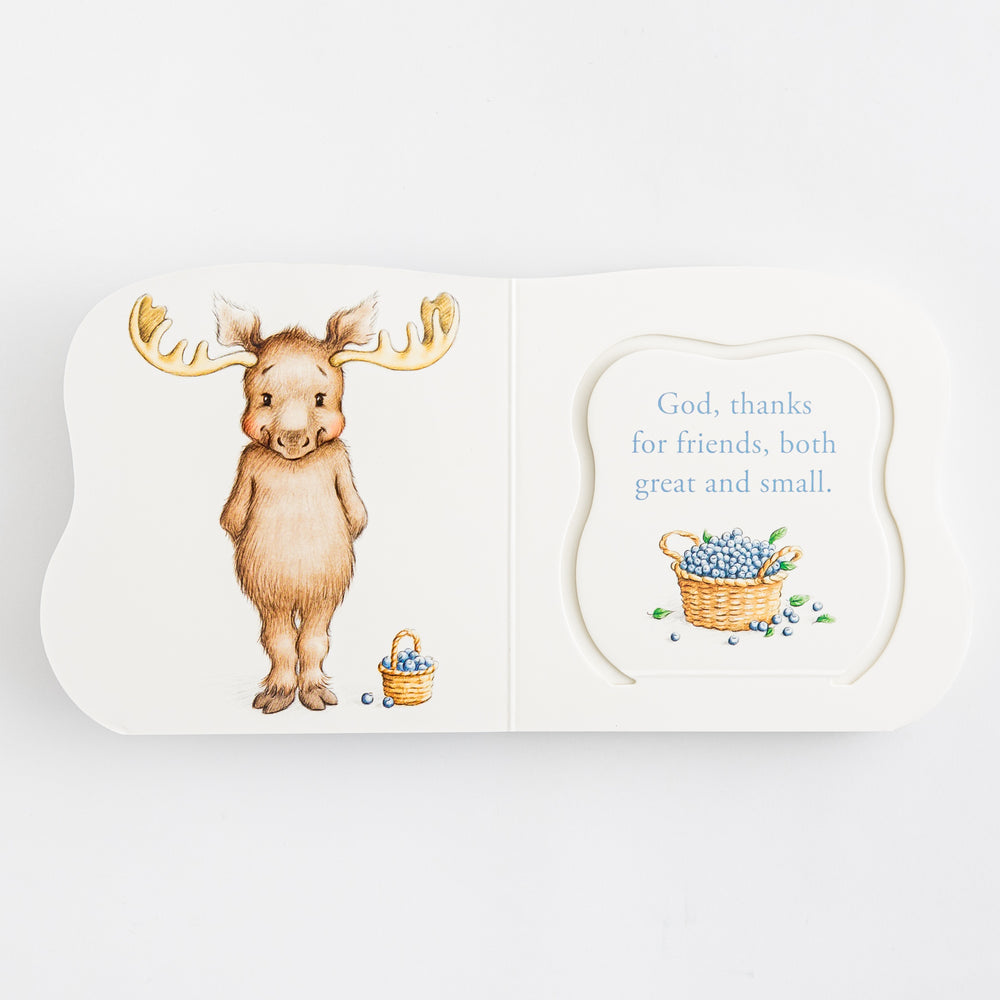 Great and Small Prayers for Babies – open shaped die-cut board book showing illustrated brown moose with gold antlers and blueberry basket on left and prayer page reading God thanks for friends both great and small with blueberry basket illustration on right – interior prayer spread