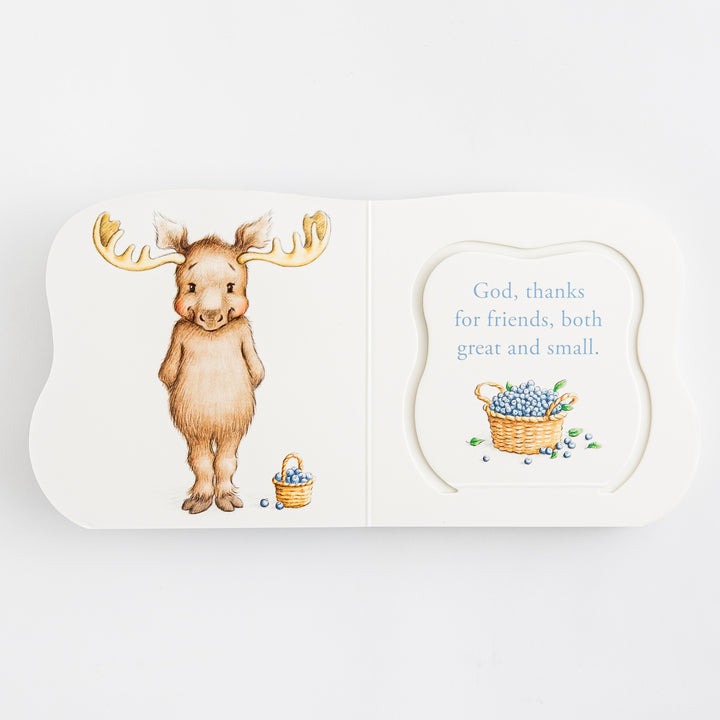 Great and Small Prayers for Babies – open shaped die-cut board book showing illustrated brown moose with gold antlers and blueberry basket on left and prayer page reading God thanks for friends both great and small with blueberry basket illustration on right – interior prayer spread