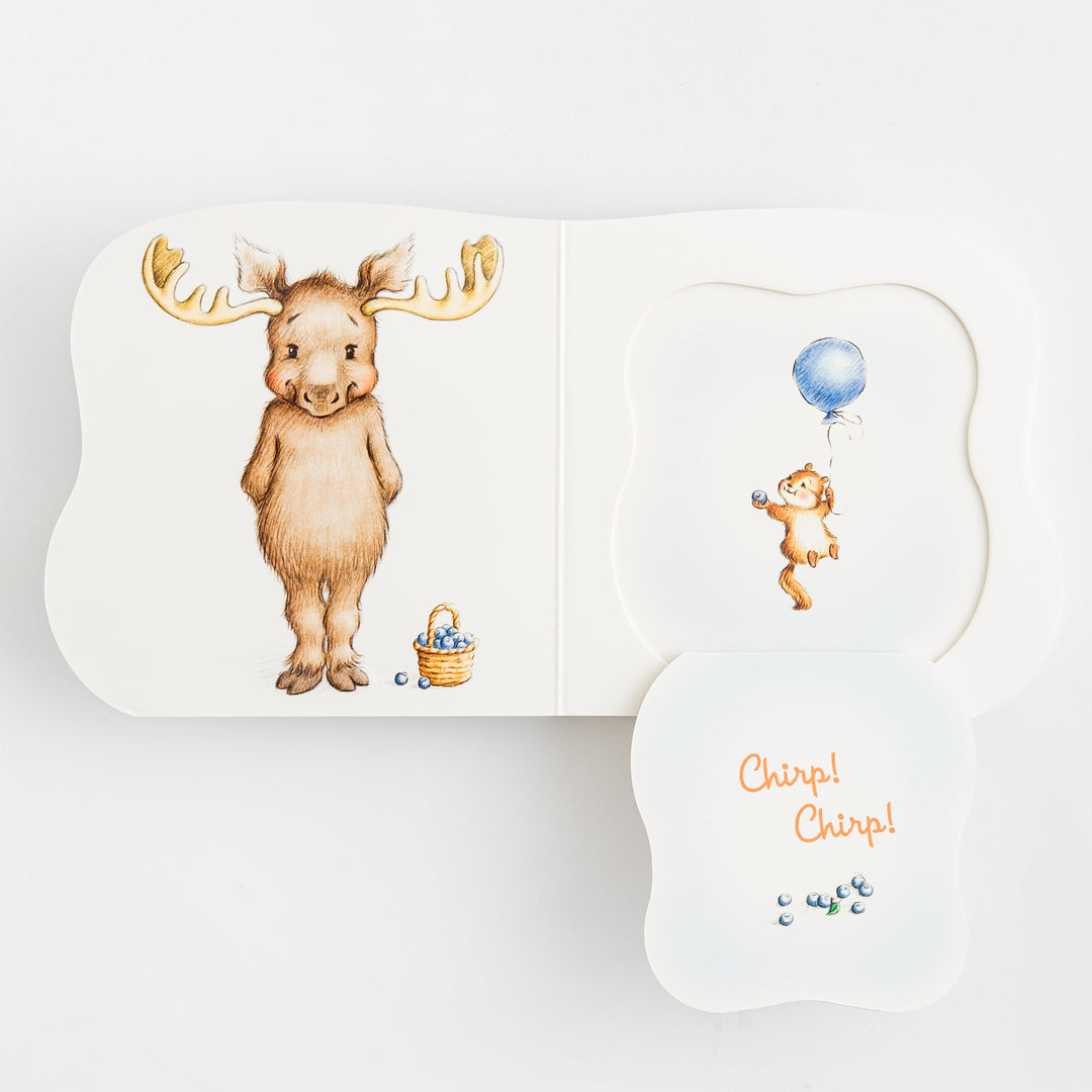 Great and Small Prayers for Babies – multiple shaped die-cut pages fanned open showing moose page a bear holding a blue balloon and Chirp Chirp page with blueberries – interior pages fanned view