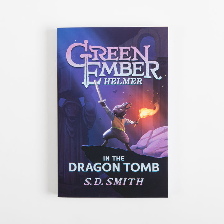 Front cover of Green Ember: Helmer in the Dragon Tomb by S.D. Smith, illustrated with a rabbit character in an orange vest raising a sword and holding a torch flame atop a dark rock ledge amid purple stone ruins.