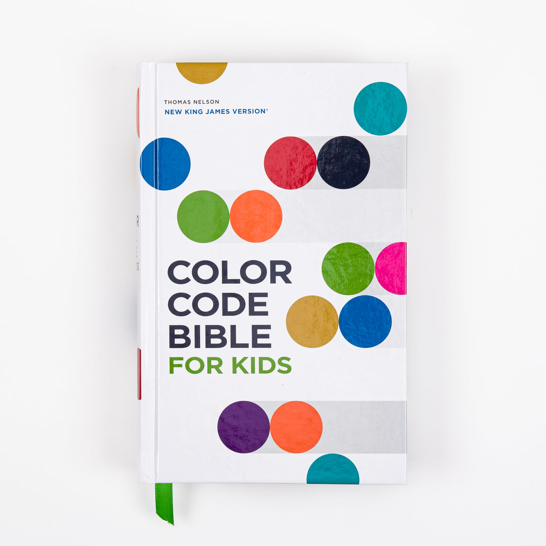 Front cover of the NKJV Color Code Bible for Kids, a white hardcover decorated with colorful circles in teal, red, navy, green, orange, magenta, gold, blue, and purple, with a green ribbon marker.