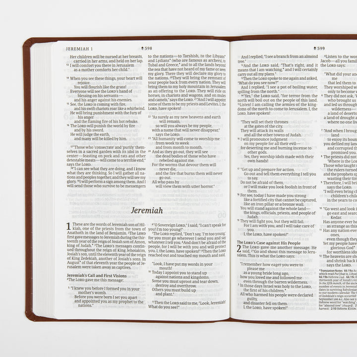 Open two-page spread showing the closing verses of the previous book on the left page and the title page for the book of Jeremiah on the right, with the subheading Jeremiah&