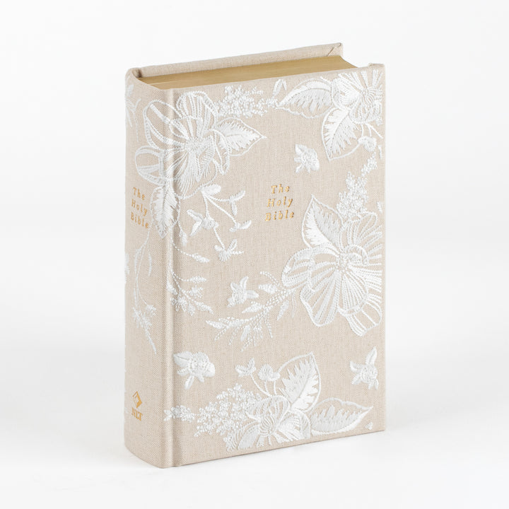 NLT Notetaking Bible, Cordova theme, cloth-over-board cover in cream linen fabric with an ivory floral and ribbon embroidery pattern, gold-lettered &