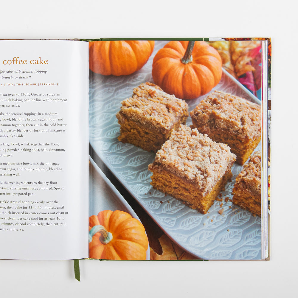 Recipe page for Pumpkin Coffee Cake with instructions and baking times, next to a photo of cinnamon streusel-topped coffee cake squares on a white platter surrounded by small decorative pumpkins.