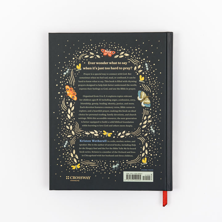 Back cover of the same navy hardcover, matching gold-dotted border with butterflies and dragonflies framing white and blue text about helping kids ages 8-12 pray through topics like anger, confession, and forgiveness, an author bio for Kristen Wetherell, the Crossway logo, and a barcode; red ribbon bookmark at bottom right.