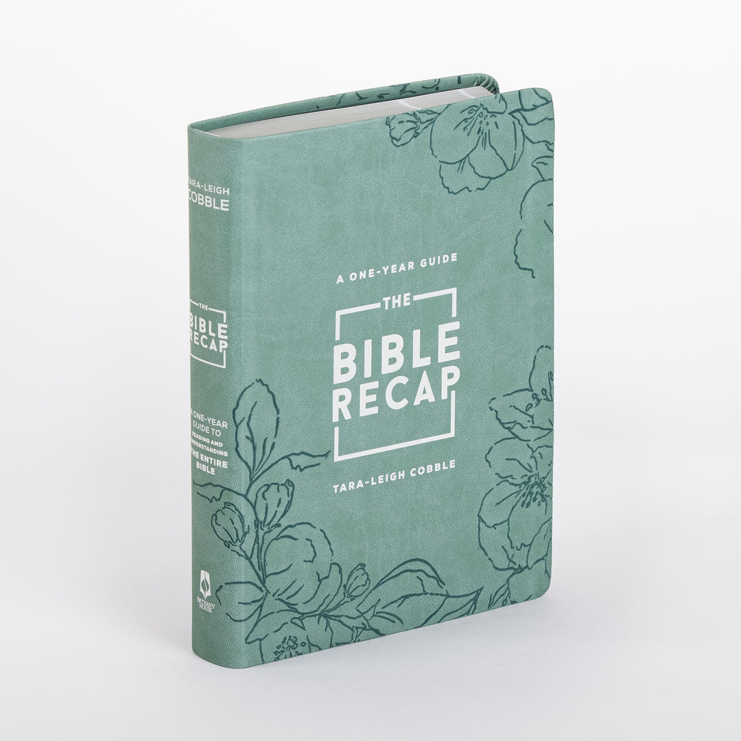 Three-quarter angle view of The Bible Recap Deluxe Edition in sage green imitation leather, showing the spine and front cover with hand-drawn floral line art and the title framed in a white outlined box, by Tara-Leigh Cobble.