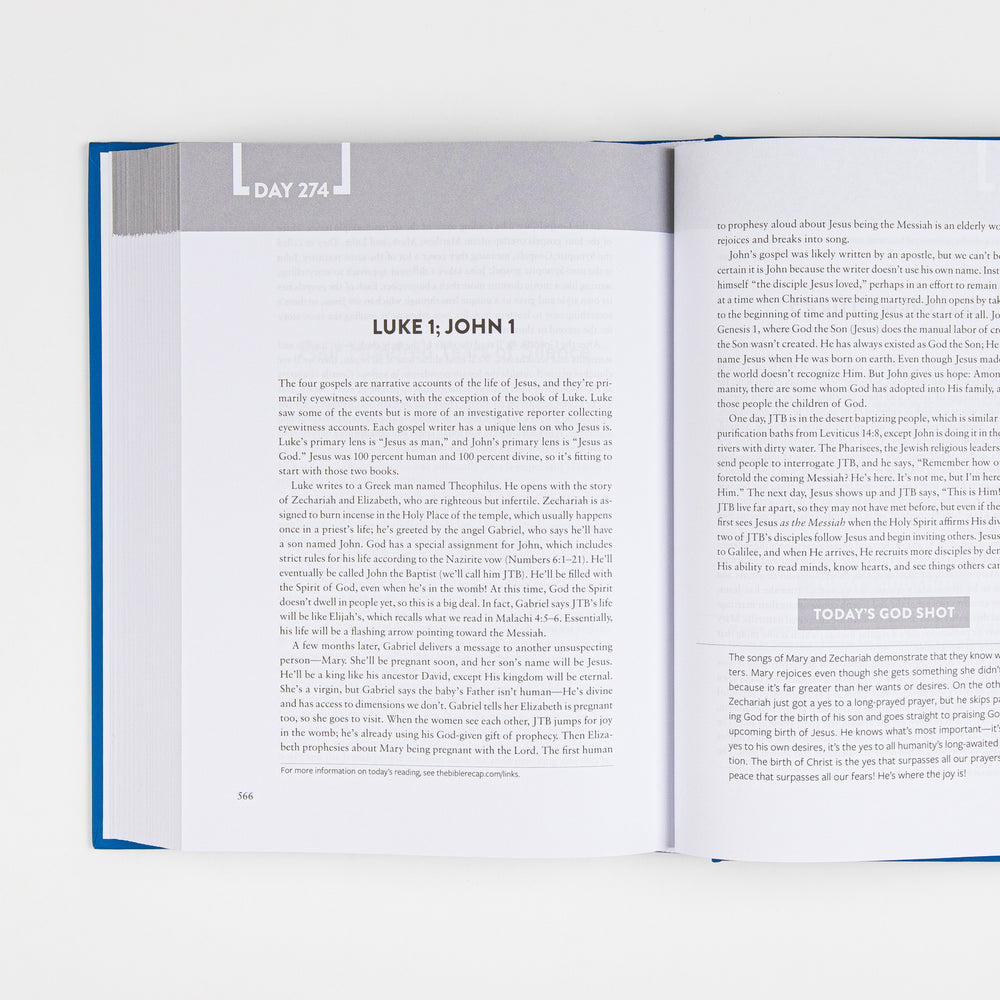 Interior spread of The Bible Recap open to Day 274, covering Luke 1 and John 1, with body text on the left page and a highlighted "Today's God Shot" takeaway box on the right page.
