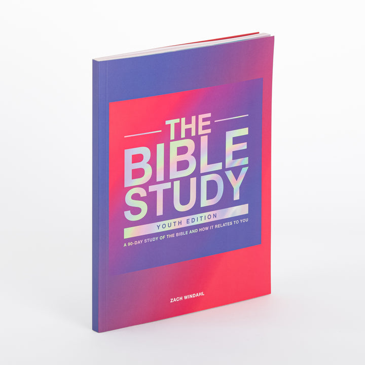Paperback book cover of The Bible Study: Youth Edition by Zach Windahl, angled to show the front and spine. The cover has a pink-to-purple gradient with an iridescent holographic square reading THE BIBLE STUDY, a YOUTH EDITION banner, and the subtitle A 90-Day Study of the Bible and How It Relates to You.