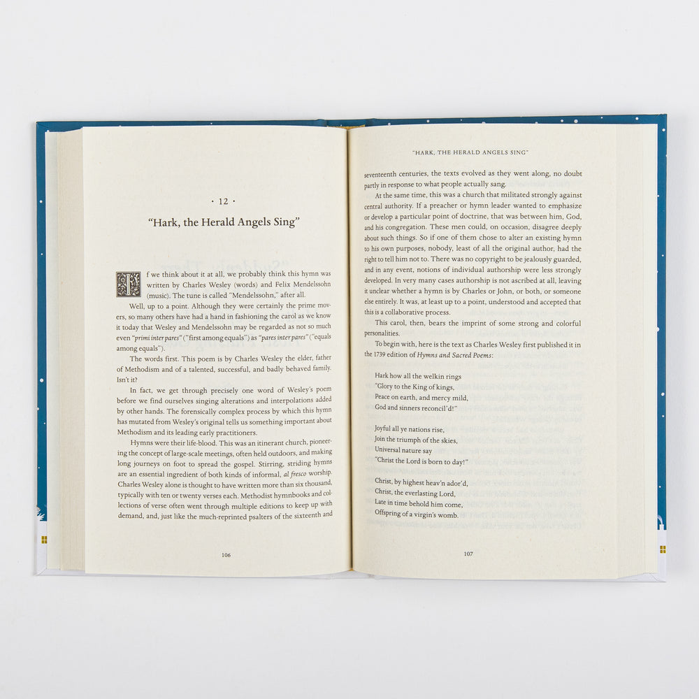 Open book spread from 'The Carols of Christmas' showing the start of Chapter 12, 'Hark, the Herald Angels Sing,' on page 106, with a small square woodcut-style illustration beside the opening paragraph. The facing page 107 continues the essay and quotes three verses of Charles Wesley's original 1739 hymn text beginning 'Hark how all the welkin rings.'