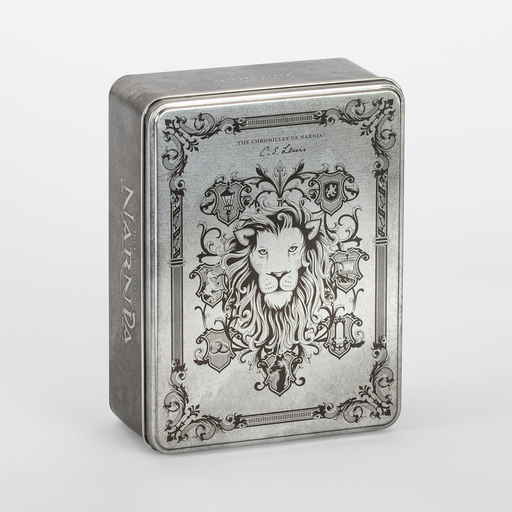 Angled three-quarter view of the closed Narnia Radio Theatre tin, engraved silver lid showing a detailed lion&