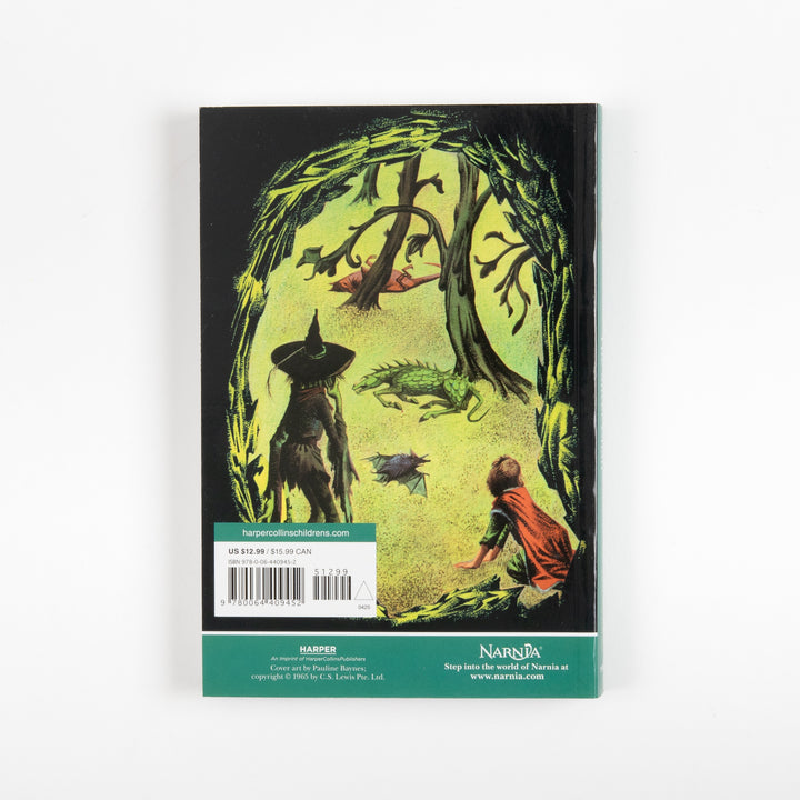 Back cover of the full-color paperback edition of The Silver Chair, showing a green-lit cave with a hooded witch figure, a dragon-like creature, a bat, and a boy crouched at the cave mouth, with a price sticker and barcode.