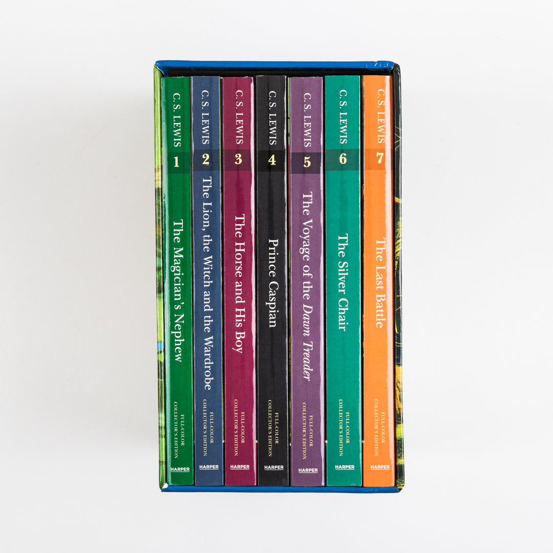 Overhead view of the seven full-color paperback spines packed side by side inside the open box, each numbered 1 through 7 with its title, from The Magician&