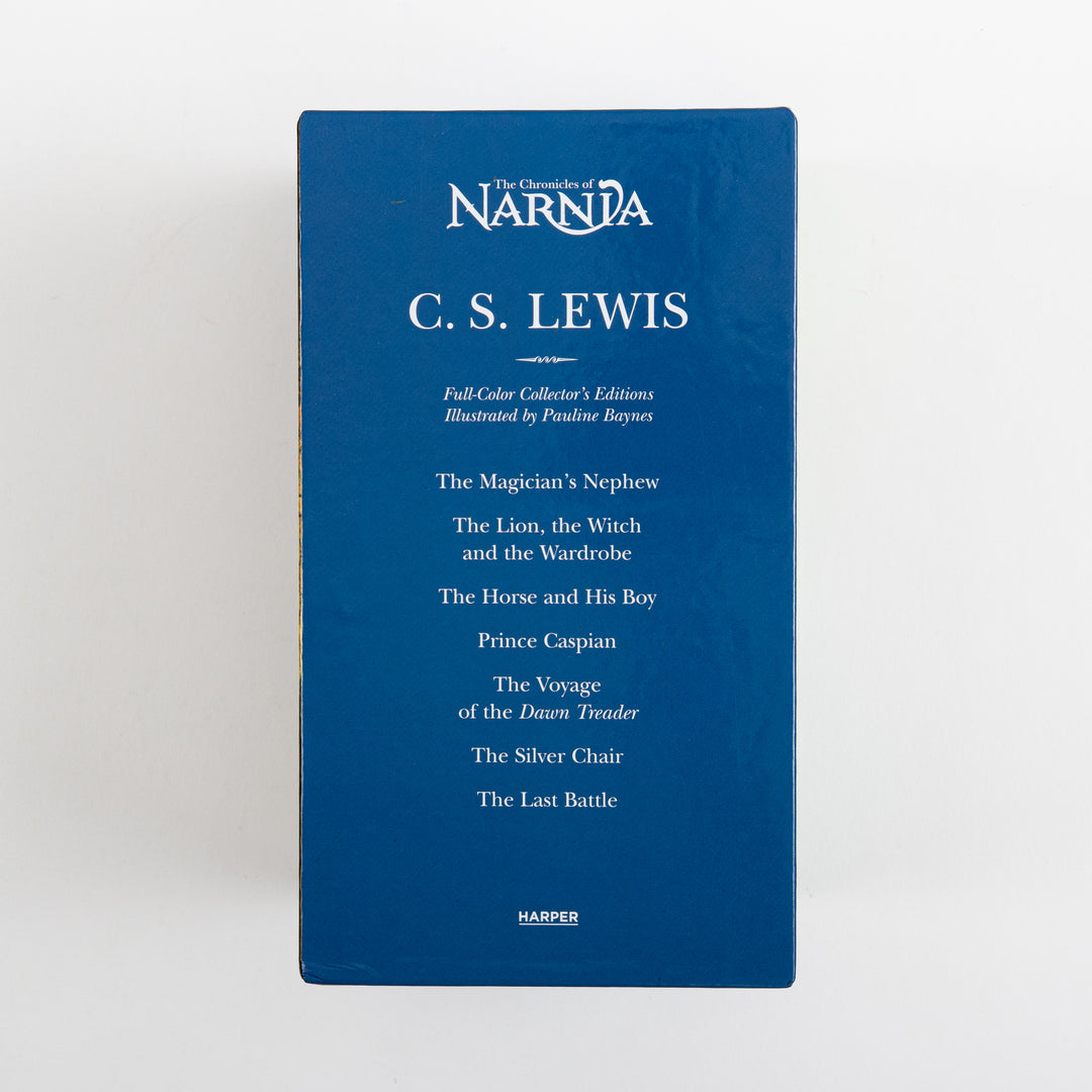 Narrow side panel of the Chronicles of Narnia full-color paperback box set, a solid dark blue surface listing C.S. Lewis&
