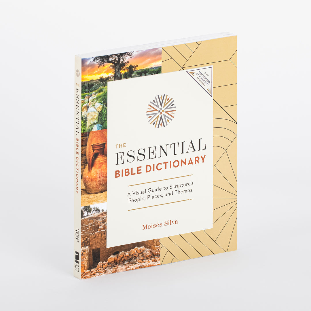 Front cover of The Essential Bible Dictionary photographed at an angle, showing the book's thickness. Tan cover with a photo collage of an olive tree at sunset, a clay jug, and ancient stone ruins down the left edge, a cream title panel with a radial compass-style emblem, and a triangular NIV Application Commentary badge in the corner.