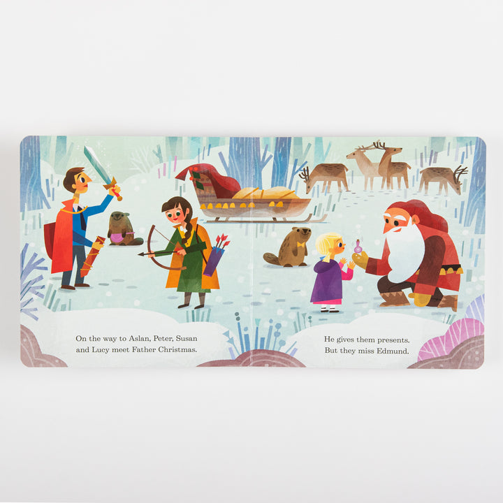 Interior spread from the board book showing Peter with a sword, Susan with a bow, beavers, reindeer, and Father Christmas in his red coat kneeling to hand Lucy a small gift bottle in a snowy forest. Text reads &