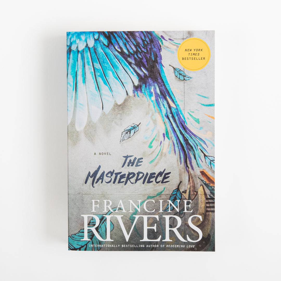Front cover of the paperback The Masterpiece by Francine Rivers, shown straight-on. A teal, turquoise, and purple painted bird wing spreads diagonally across a gray, concrete-like textured background, with small feather illustrations floating nearby and a yellow New York Times Bestseller sticker in the upper right corner. The title is in bold navy brush-script lettering above the author&