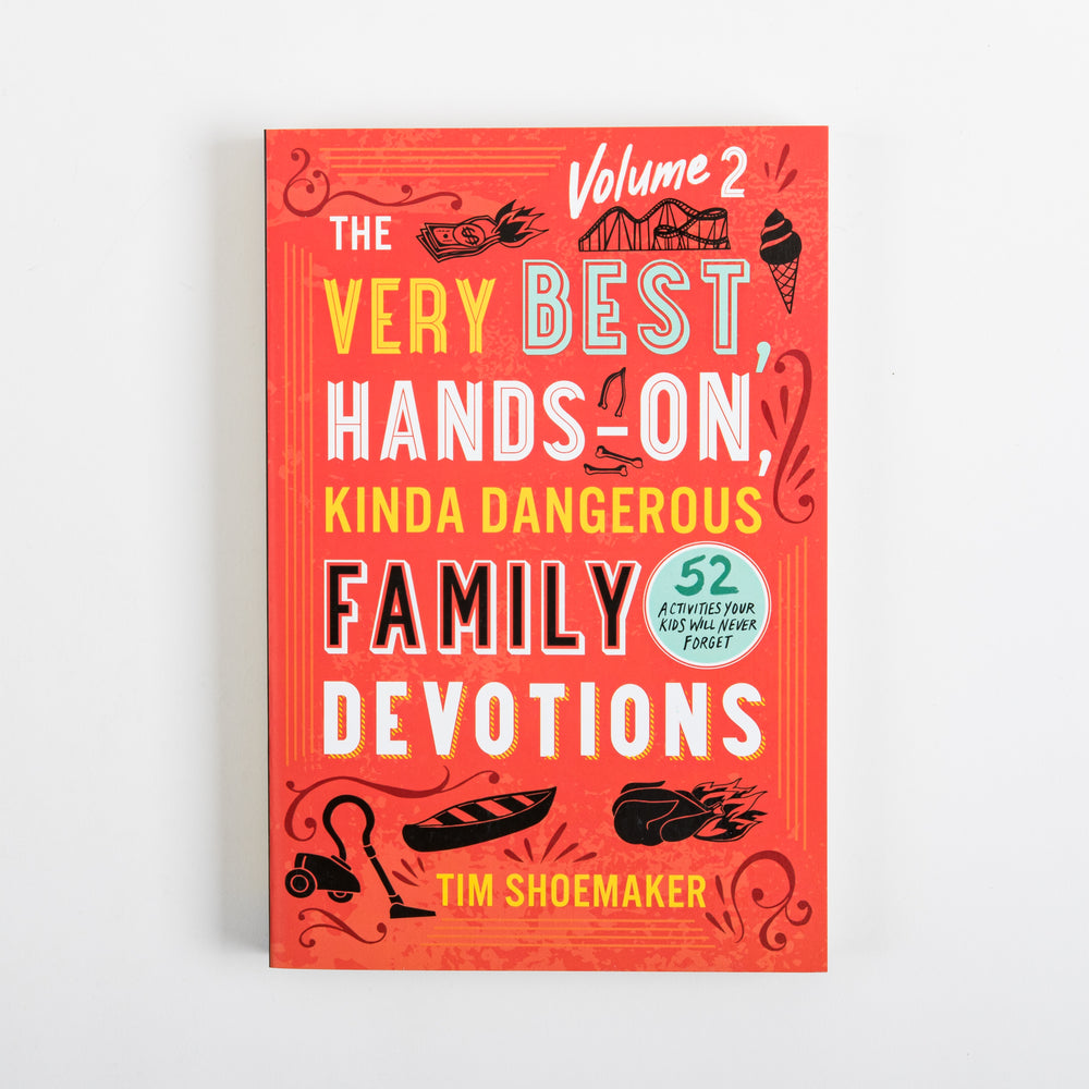 Flat front cover of 'The Very Best, Hands-On, Kinda Dangerous Family Devotions, Volume 2' by Tim Shoemaker on a red-orange background, with playful black line-art icons (cash, roller coaster, ice cream cone, canoe, vacuum) and a badge reading '52 Activities Your Kids Will Never Forget.'