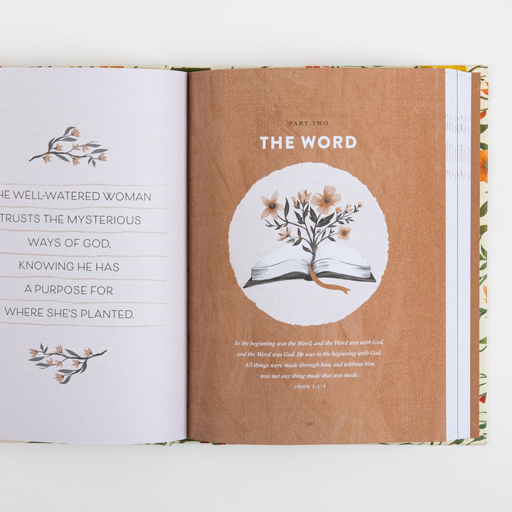 Open book spread showing the Part Two section title page The Word, with a circular illustration of an open Bible sprouting a flowering branch and a John 1:1-3 quote, facing a page reading The Well-Watered Woman trusts the mysterious ways of God, knowing He has a purpose for where she&
