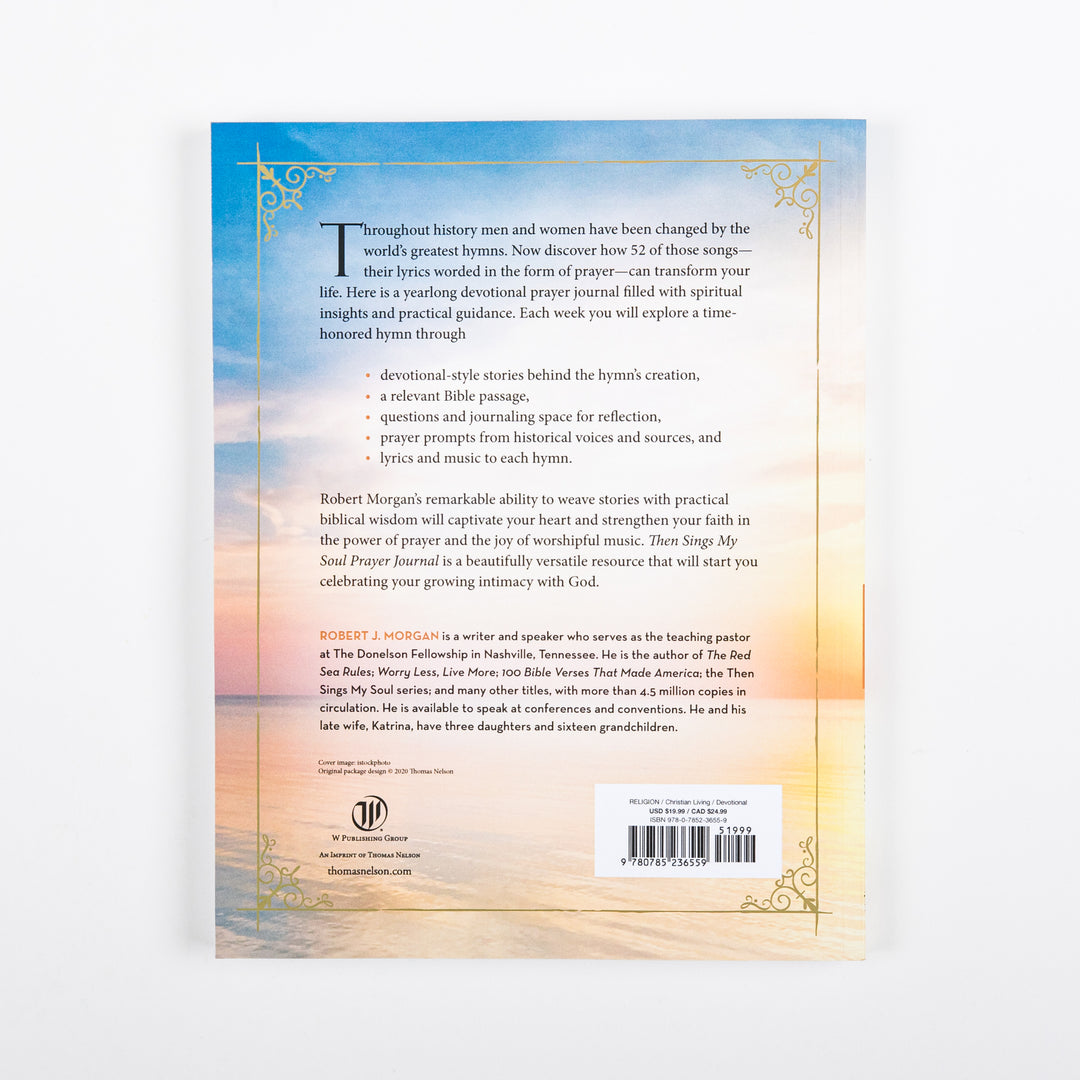 Back cover of the prayer journal with a sunset-ocean background matching the front, descriptive copy about the yearlong devotional format (hymn stories, Bible passages, reflection questions, prayer prompts, and hymn lyrics/music), an author bio for Robert J. Morgan, the W Publishing Group/Thomas Nelson logo, and a price/barcode panel.
