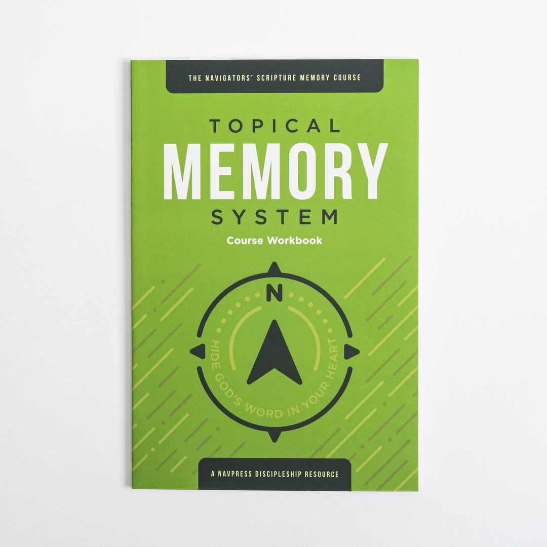Flat front cover of the green Topical Memory System Course Workbook, featuring a black compass-arrow icon and the tagline &