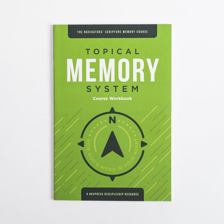 Flat front cover of the green Topical Memory System Course Workbook, featuring a black compass-arrow icon and the tagline &
