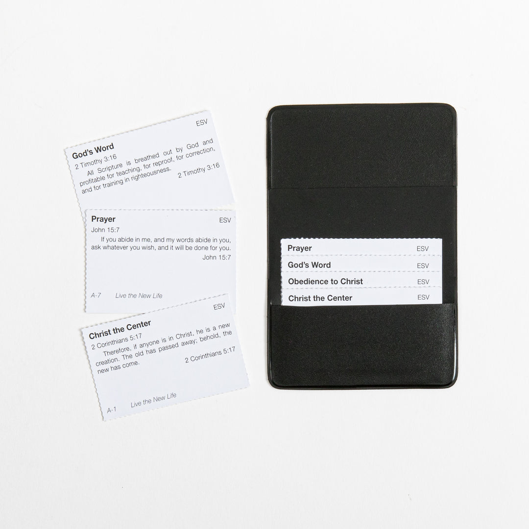 Close-up of the black vinyl memory verse card pouch, open to show an inserted card list (Prayer, God&