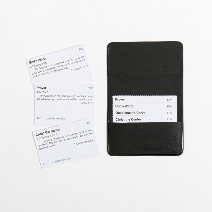 Close-up of the black vinyl memory verse card pouch, open to show an inserted card list (Prayer, God&