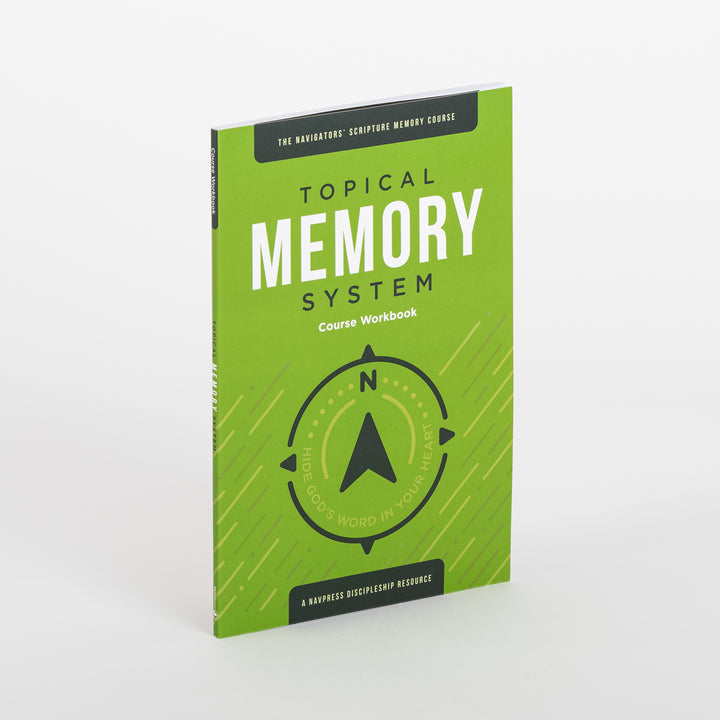 Angled product shot of a single green Topical Memory System Course Workbook, standing upright to show both the front cover and the spine labeled &