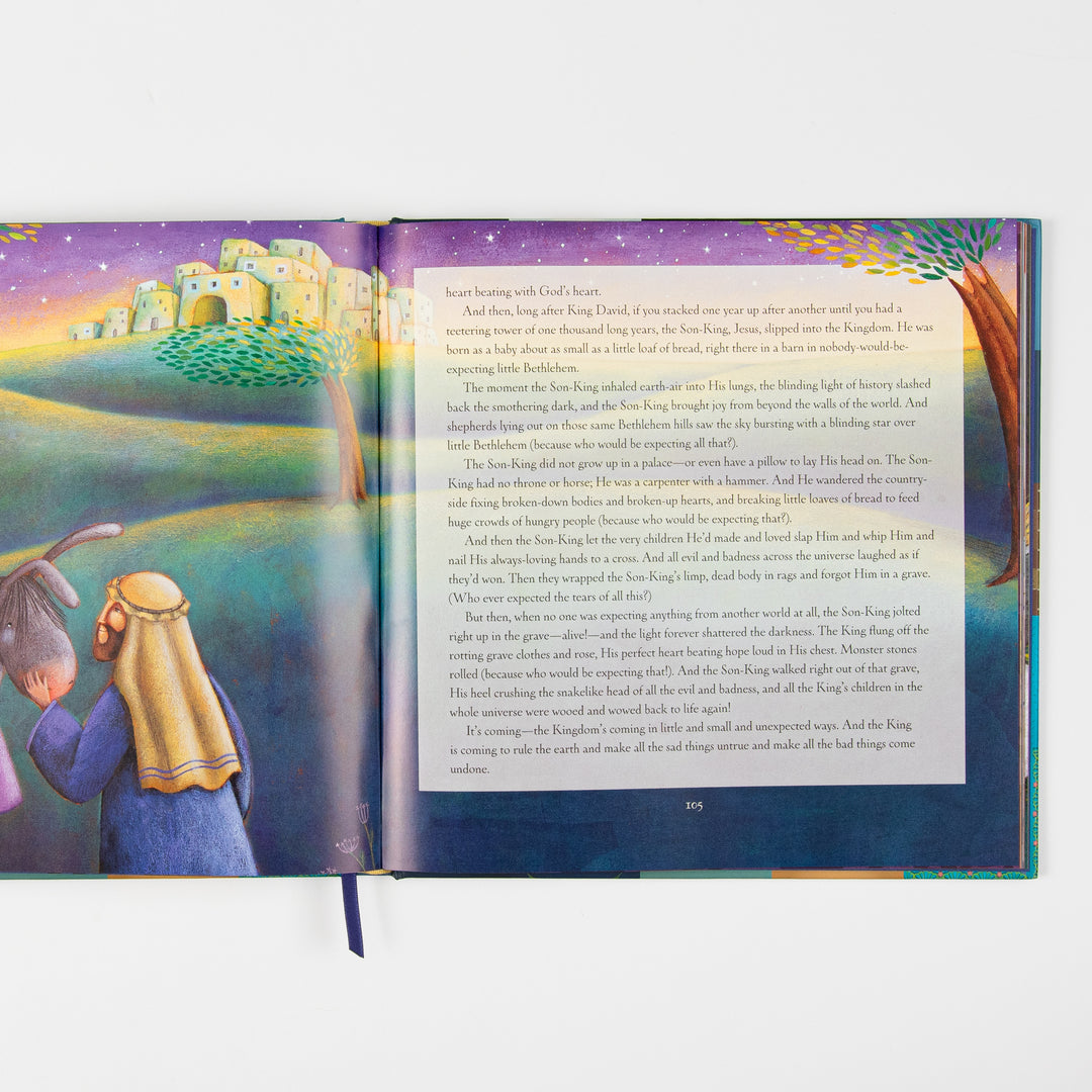 Open interior spread: left page shows an illustration of Joseph in a blue robe leading a donkey toward a hillside town glowing at twilight under a purple and gold starry sky; right page has devotional text describing the birth of Jesus, numbered page 105.