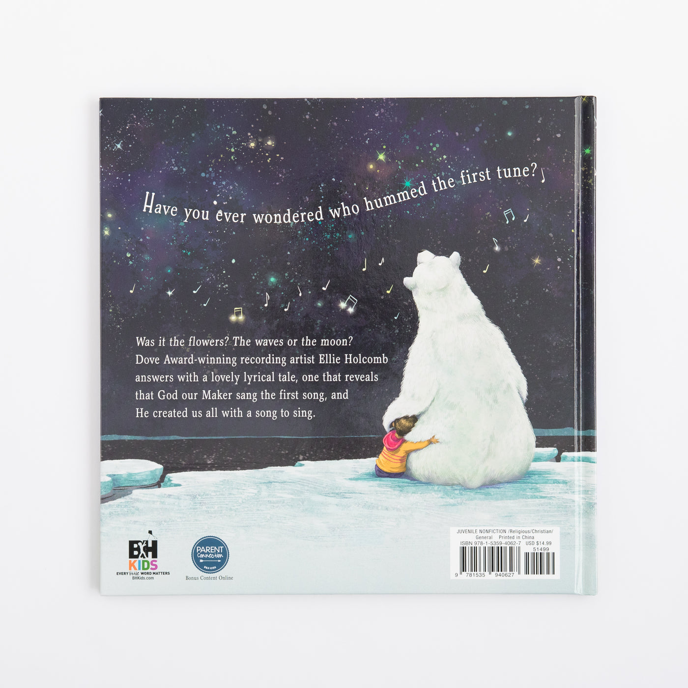 Book back cover with a polar bear and child on a snowy landscape, featuring text and a starry sky.