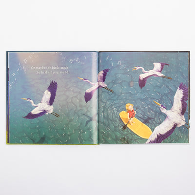 Illustrated book open to pages with birds and a child on a raft.