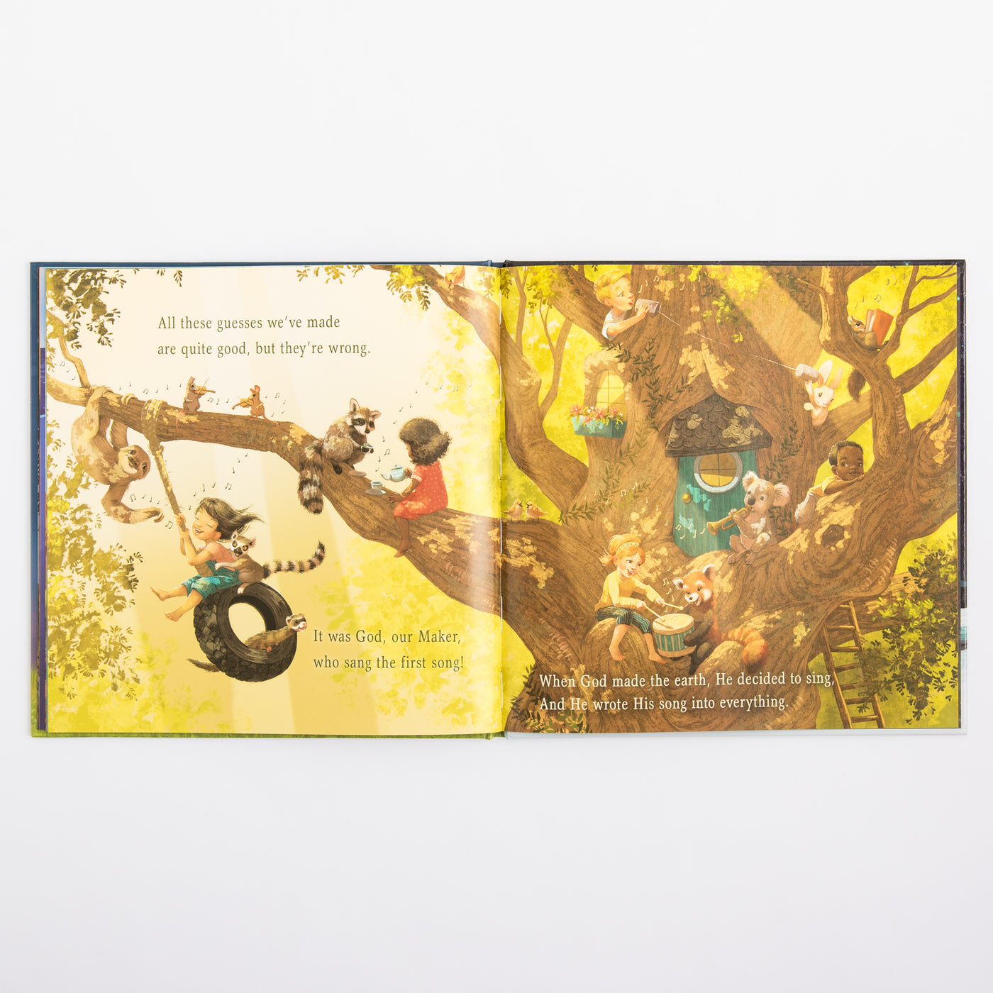 Open book with colorful illustrations of children playing in a tree